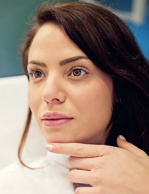 Woman considering her lip proportions before lip filler